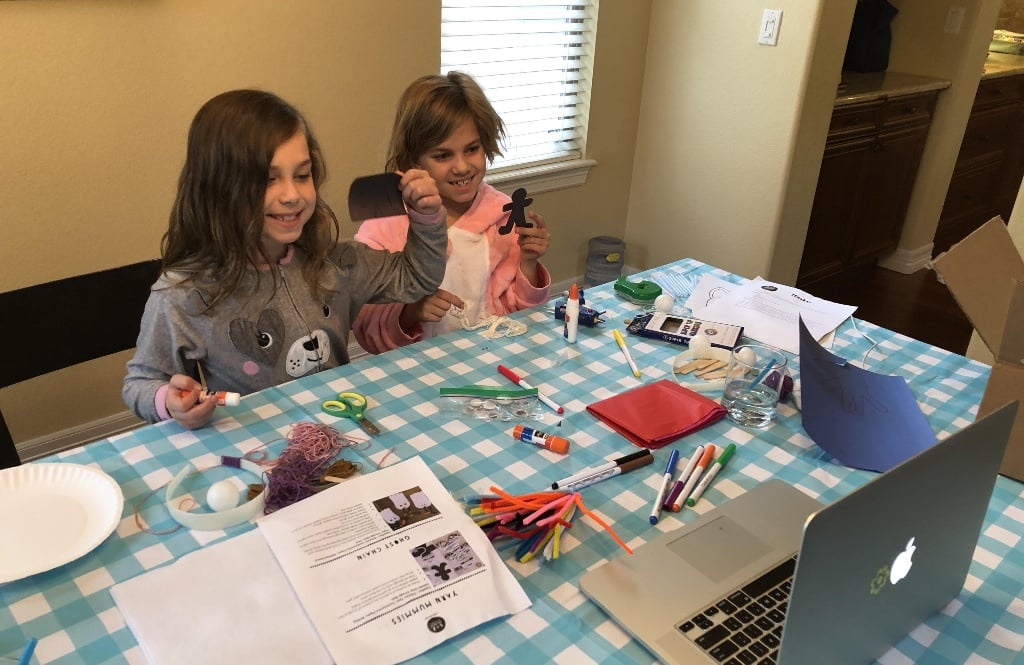 Two sibling campers engaging in a camp-at-home craft thanks to Roundup River Ranch, the SeriousFun camp in Colorado