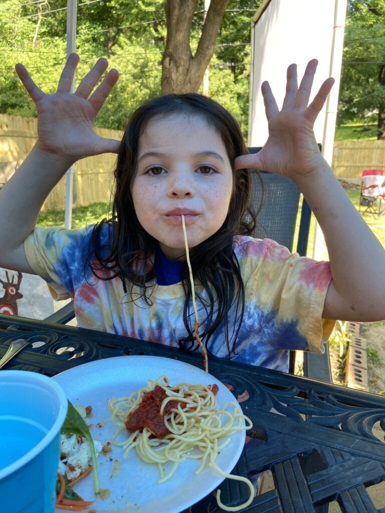 kateri enjoys a camp tradition called 'no hands spaghetti'